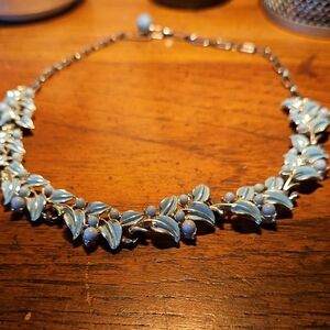 Coro blue enamel leaf choker necklace with faux pearl cabochon and lucite links.